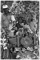 Decorated trishaw driver and passengers. Malacca City, Malaysia ( black and white)