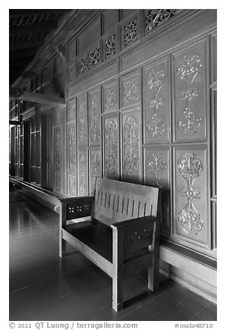 Wood panel and chair, sultanate palace. Malacca City, Malaysia