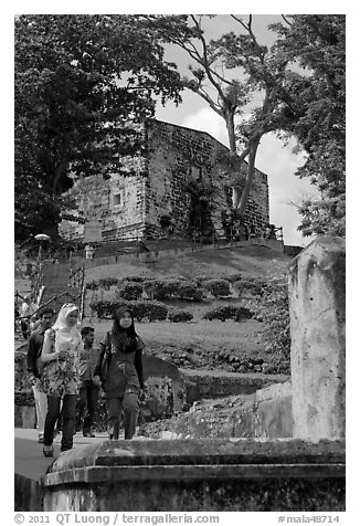 Malay tourists descend stairs from St Paul Hill. Malacca City, Malaysia