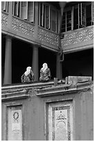 Women sitting, Stadthuys. Malacca City, Malaysia (black and white)