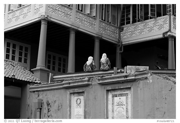 Stadthuys detail with two women. Malacca City, Malaysia (black and white)