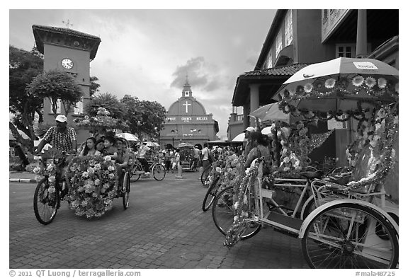 Trishaws, clock tower, and church. Malacca City, Malaysia (black and white)