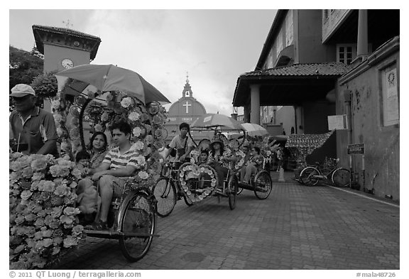 Trishaws leaving Town Square and Stadthuys. Malacca City, Malaysia (black and white)