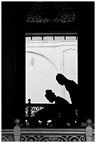 Silhouettes of men bowing in worship, Masjid Kampung Hulu. Malacca City, Malaysia (black and white)