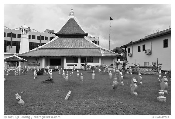 Cemetery, Mosque, and Moorish watchtower minaret. Malacca City, Malaysia (black and white)