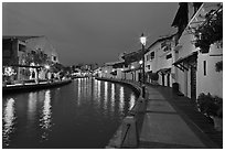 Houses and walkway at dusk, Melaka River. Malacca City, Malaysia (black and white)