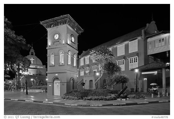 Town Square with Stadthuys, clock tower, and church at night. Malacca City, Malaysia (black and white)