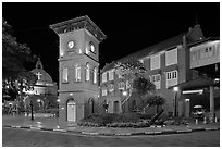 Town Square with Stadthuys, clock tower, and church at night. Malacca City, Malaysia (black and white)