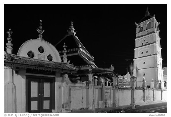 Gate, Mosque, and minaret, Masjid Kampung Hulu at night. Malacca City, Malaysia (black and white)