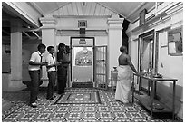 Worhipers and holy man, Sri Poyyatha Vinayagar Moorthi Temple. Malacca City, Malaysia ( black and white)