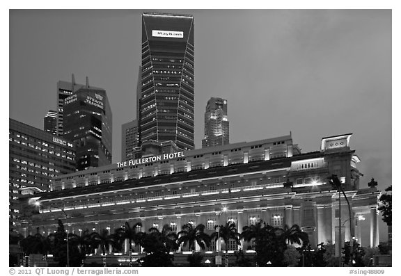 Fullerton Hotel and high rises at dusk. Singapore