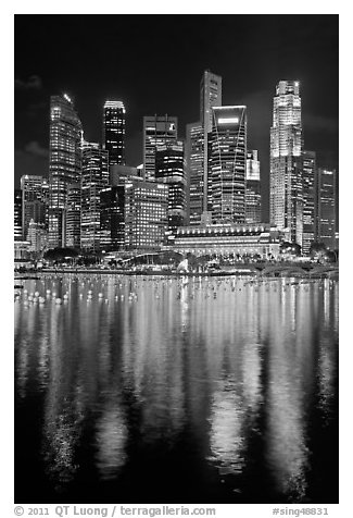 Fullerton Hotel and skyline at night. Singapore (black and white)