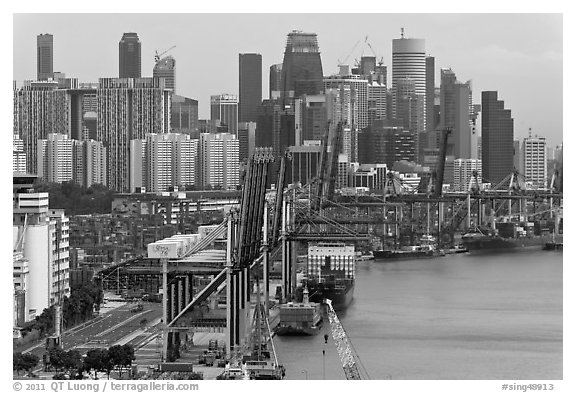 Cranes in harbor and CBD skyscrappers. Singapore (black and white)