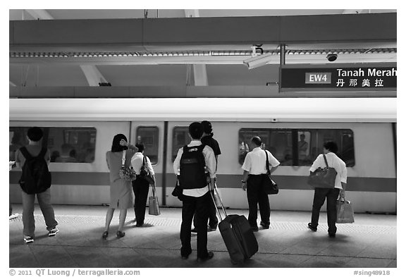 Passengers preparing to board MRT train. Singapore (black and white)