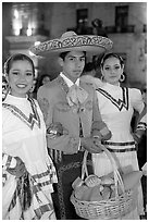 Man with sombrero hat surrounded by  two women. Guadalajara, Jalisco, Mexico (black and white)