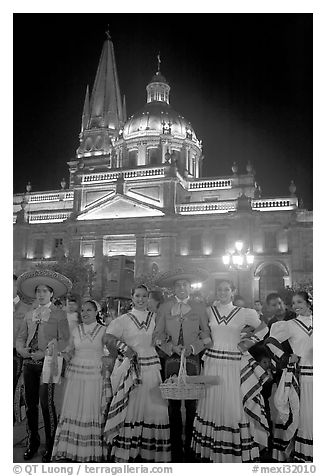 Men and women in traditional mexican costume with Cathedral in background. Guadalajara, Jalisco, Mexico