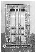 Window and multicolored wall. Guadalajara, Jalisco, Mexico (black and white)