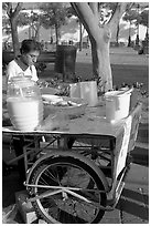 Food vendor with a wheeled food stand. Guadalajara, Jalisco, Mexico (black and white)