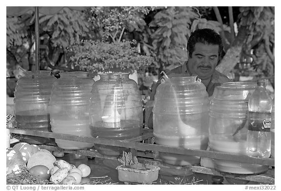 Multicolored drinks offered on a street stand. Guadalajara, Jalisco, Mexico (black and white)