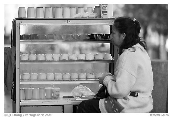 Woman selling dairy desserts on the street. Guadalajara, Jalisco, Mexico (black and white)