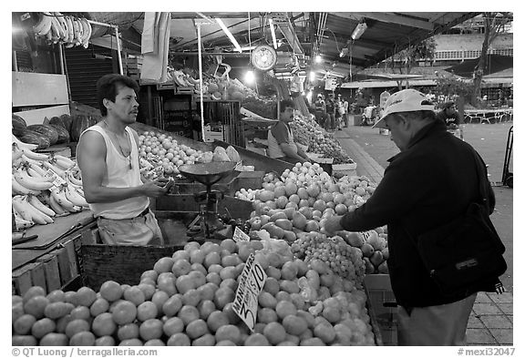 Fruit vending in Mercado Libertad. Guadalajara, Jalisco, Mexico (black and white)
