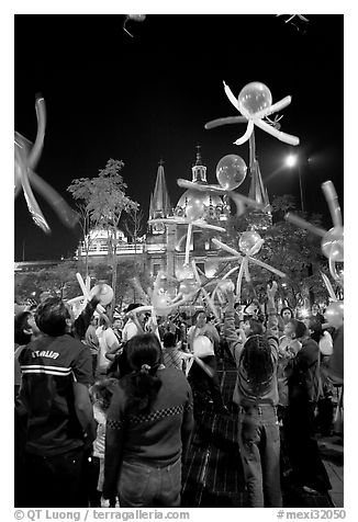 Children playing with ballons behind the Cathedral on  Plaza de la Liberacion. Guadalajara, Jalisco, Mexico