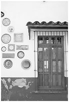 Wall decorated with colorful ceramic pieces, Tlaquepaque. Jalisco, Mexico (black and white)