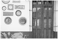 Wall decorated with colorful ceramic pieces, Tlaquepaque. Jalisco, Mexico (black and white)