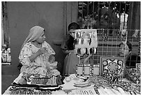 Huichol women selling crafts on the street, Tlaquepaque. Jalisco, Mexico (black and white)