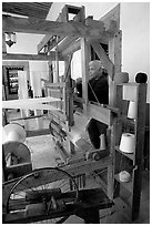 Traditional weaver and machine seen from the side, Tlaquepaque. Jalisco, Mexico (black and white)