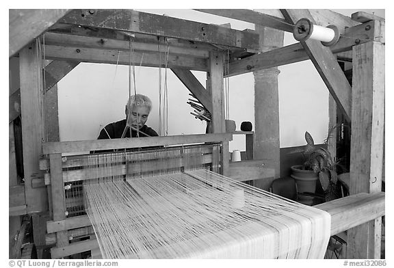 Weaver operating a traditional machine, Tlaquepaque. Jalisco, Mexico