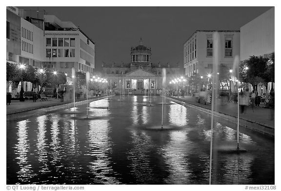 Plaza Tapatia at night with Hospicio Cabanas reflected in basin. Guadalajara, Jalisco, Mexico