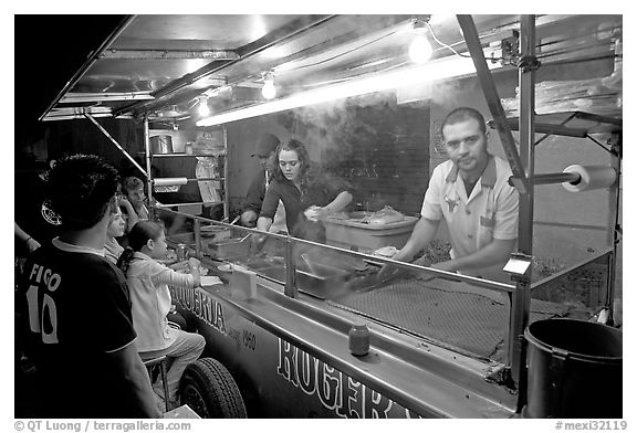Food  stand in the street at night, Tlaquepaque. Jalisco, Mexico (black and white)