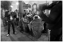 Mariachi musicians performing a serenade at the Parian, Tlaquepaque. Jalisco, Mexico (black and white)