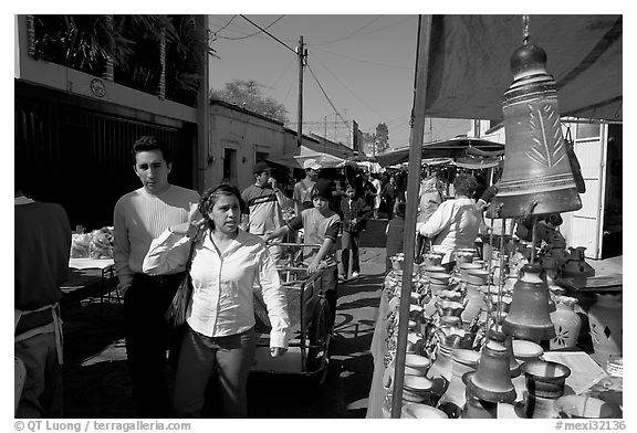 People strolling iin the sunday town-wide arts and crafts market, Tonala. Jalisco, Mexico (black and white)