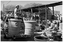 Pots being loaded on the back of a pick-up truck, Tonala. Jalisco, Mexico ( black and white)