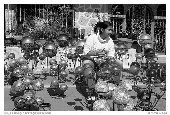 Woman polishing glass spheres, Tonala. Jalisco, Mexico (black and white)