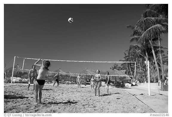 Vacationers playing beach volley-ball, Nuevo Vallarta, Nayarit. Jalisco, Mexico (black and white)