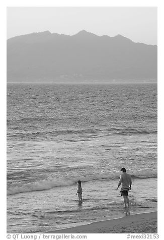 Man and child on the beach at sunset, Nuevo Vallarta, Nayarit. Jalisco, Mexico