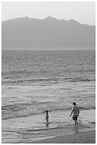 Man and child on the beach at sunset, Nuevo Vallarta, Nayarit. Jalisco, Mexico (black and white)