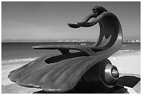 Sculpture by Bustamante on the seaside walkway with beach in the background, Puerto Vallarta, Jalisco. Jalisco, Mexico ( black and white)