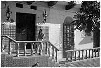 Woman waiting at the door of a house, Puerto Vallarta, Jalisco. Jalisco, Mexico (black and white)