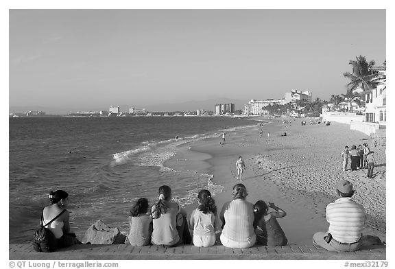 Family sitting above the beach, late afternoon, Puerto Vallarta, Jalisco. Jalisco, Mexico