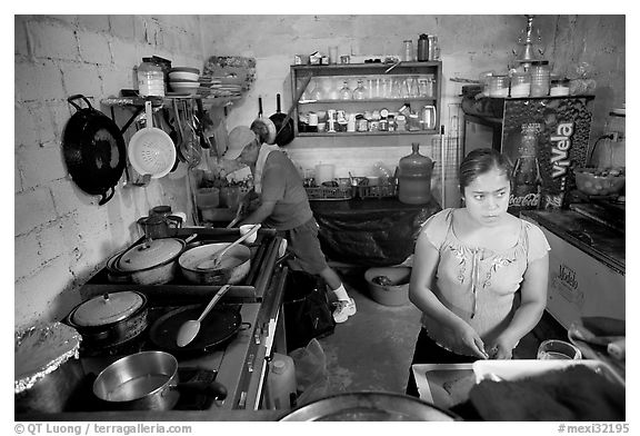 Woman and man in a restaurant kitchen, Jalisco. Jalisco, Mexico (black and white)