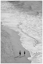 Couple walking on the beach seen from above, Puerto Vallarta, Jalisco. Jalisco, Mexico (black and white)