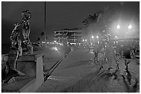 People strolling on the Malecon at night, Puerto Vallarta, Jalisco. Jalisco, Mexico (black and white)