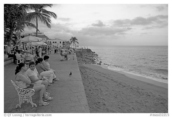 Women sitting on a bench looking at the ocean, Puerto Vallarta, Jalisco. Jalisco, Mexico (black and white)