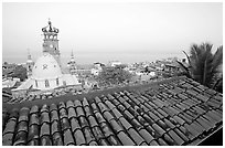 Tiled rooftop and Cathedral, and ocean at dawn, Puerto Vallarta, Jalisco. Jalisco, Mexico (black and white)