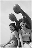 Women sitting on the sculpture called Nostalgia, Puerto Vallarta, Jalisco. Jalisco, Mexico (black and white)
