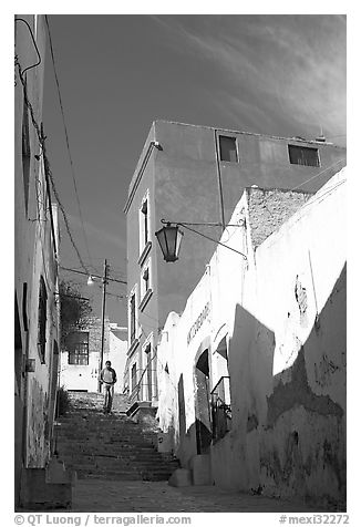 Man walking down stairs of Cajaon de Garcia Rojas. Zacatecas, Mexico (black and white)